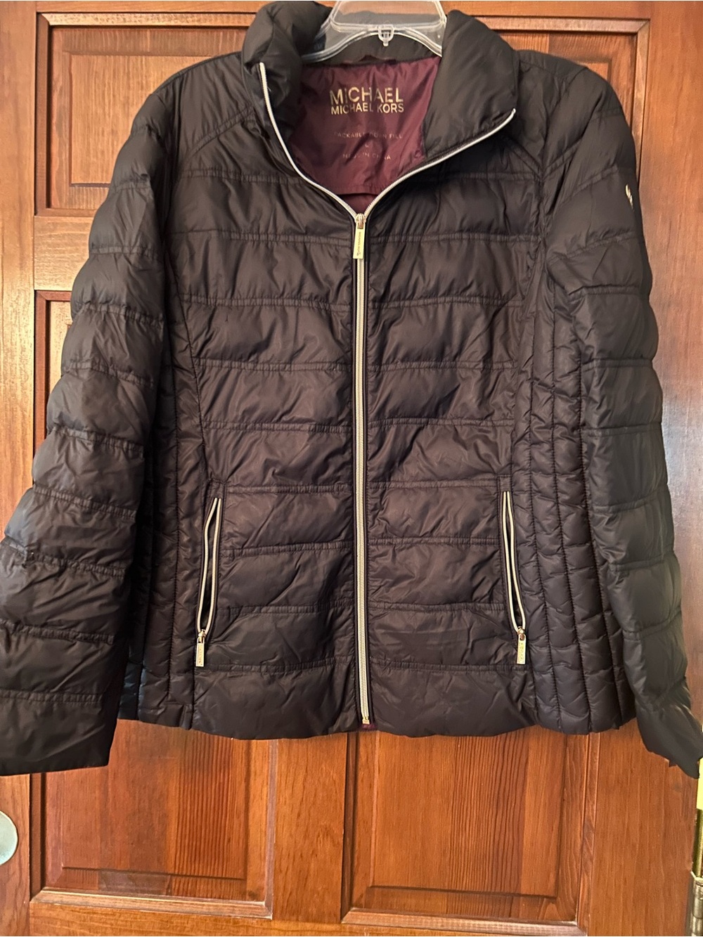 Michael Kors packable down fill ladies jacket. Black size large. Missing hood